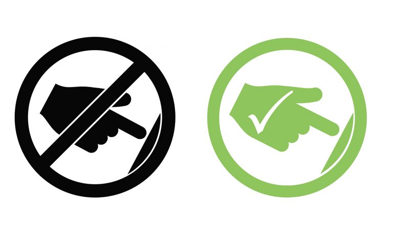 Symbols of hand with cross through it and hand with tick on it